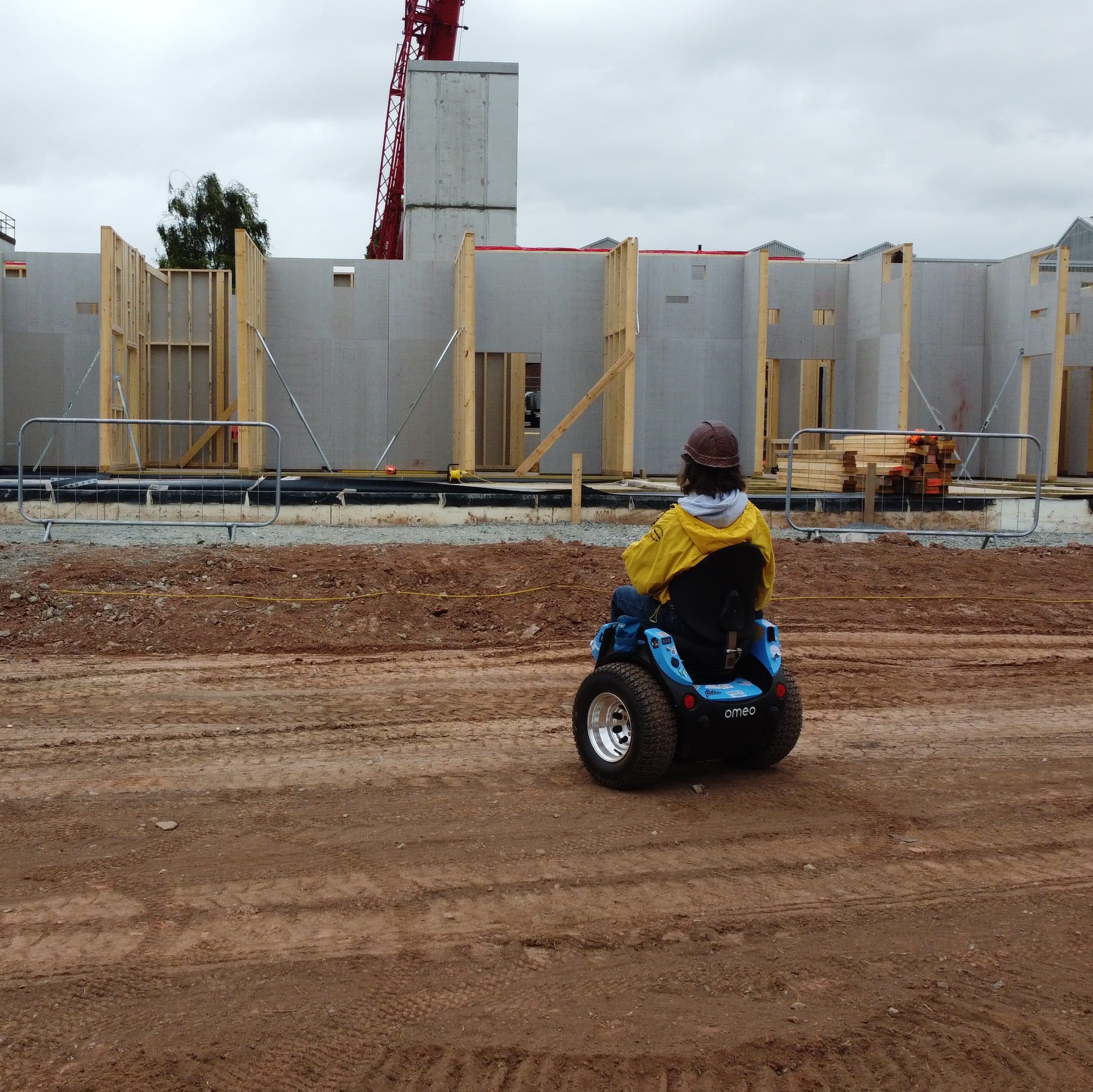 Omeo user in the workplace engaging with colleagues