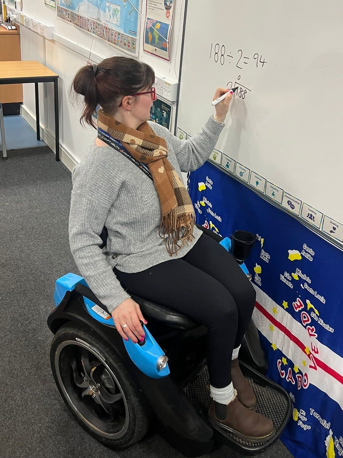 Omeo user completing tasks hands-free in a professional setting