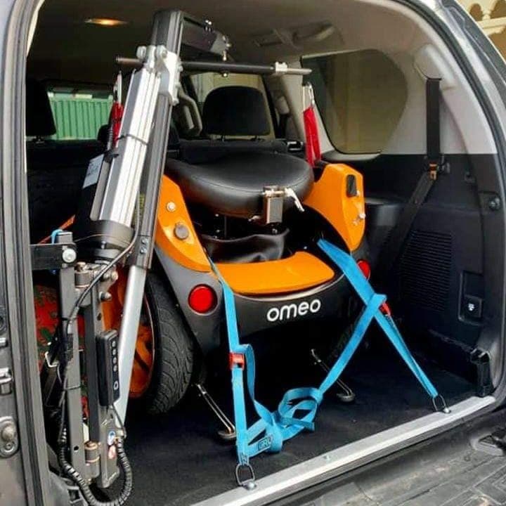 Omeo secured in car boot via hoist